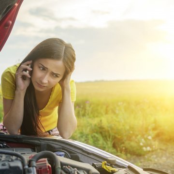 usaa financial services extended car warranty vehicle service contracts car insurance car problem car with open hood green field in the background girl on the phone 